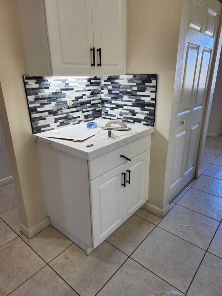 Small Cabinet Installation with Mosaic Tile Backsplash Mid-Remodel - Handyman Group SFL