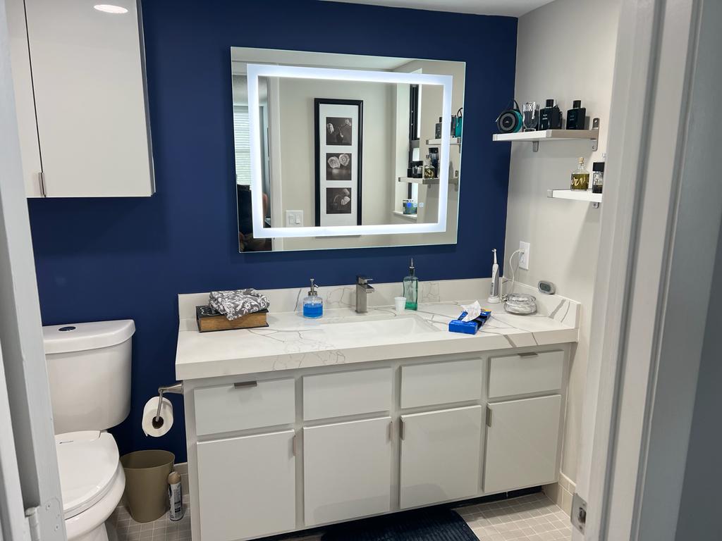 Bathroom Remodel with Navy Wall and Lighted Vanity Mirror - Handyman Group SFL